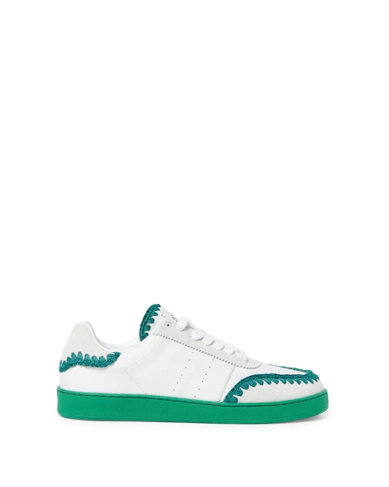 White leather and suede low-top sneaker with green crochet trim and green sole on white, for Loeffler Randall.